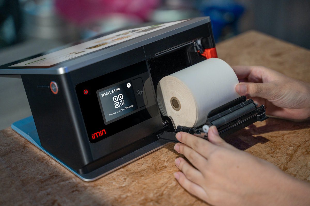 pexels-imin-technology-12935090 (1) Women printing the Logo Design